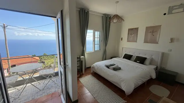 A bedroom with a private terrace and a view of the Atlantic