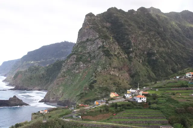 Green cliffs and terraced fields above the Atlantic coast